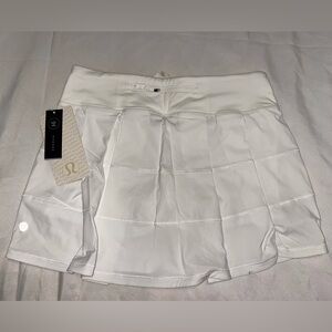 NWT Lululemon Pace Rival Skirt II *T in white. Size 6. Small spot on hem